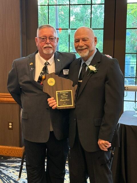 Inductee Michael Heiser with President Doug Sleaford