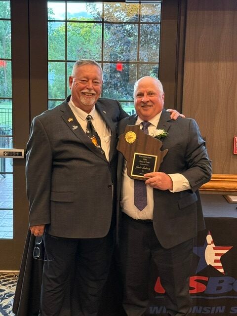 Inductee John Schmitz with President Doug Sleaford