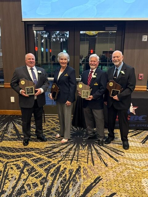 Inductees John Schmitz, Shirley Levens, Roger Dalkin, and Michael Heiser